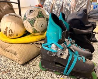 Inline skates with soccer ball and Wilson volleyball