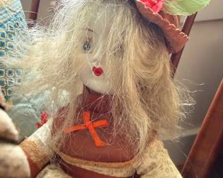 Handmade cloth folk art doll with straw hat