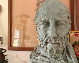 Sculpted portrait bust of bearded man with inscription
