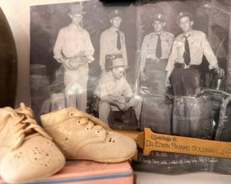 Vintage leather baby shoes and antique black-and-white photograph