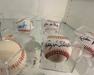 Collection of autographed baseballs in display cubes