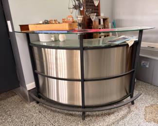 Modern curved stainless steel and glass home bar