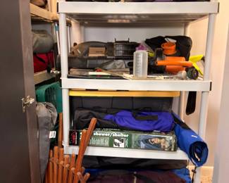 Closet of camping gear, duffel bags and outdoor supplies