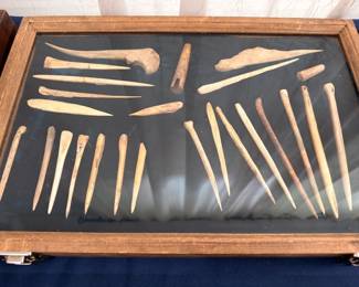 Native American bone and antler tools, awls and needles, display case