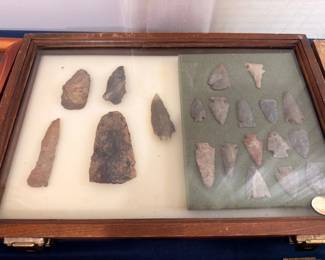 Native American stone tools and arrowheads, wooden display case