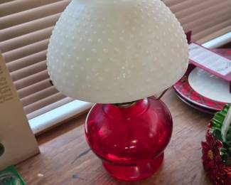 Ruby red coal oil lamp with milk glass hobnail shade