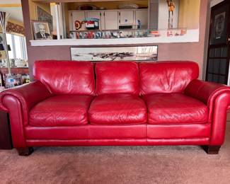 Red Leather Upholstered Three-Seat Sofa. Measures 88" W x 40" D. Photo 1 of 4. 