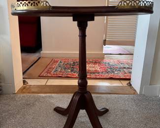 Kidney Shape Side Table with Brass Gallery. Measures 20" W x 12" D x 20" H to Top of Gallery. Photo 1 of 5. 