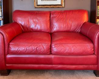 Coordinating Red Leather Two-Seat Loveseat. Measures 66" W x 40" D. 