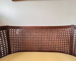 Cane Frame Settee / Bench. Significant Fading on Cushion. Cane Needs Repair. Measures 43" W x 23" D with 18" Seat Height.  Photo 2 of 5. 