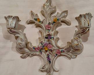 Porcelain candle wall sconce.