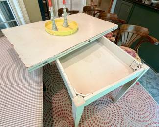 Pivoting flip top dining table.