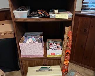 Wooden Bookshelf with Assorted Craft Supplies and Storage Boxes