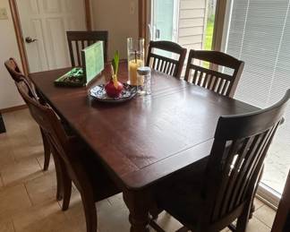 Dark Stained Wooden Dining Table and Chairs Set