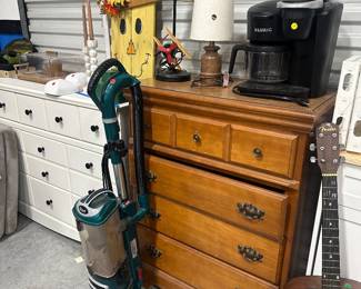 Dresser, guitar, vacuum 
