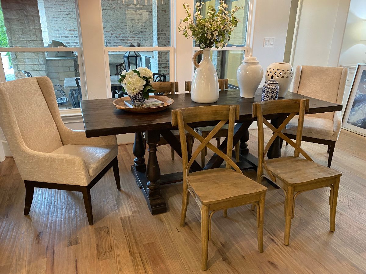 Dark wood trestle dining table, world market bent wood dining chairs, world market wing back chairs , large ginger jars, blue & white decor  