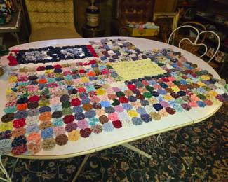 Yo-yo quilt, unfinished.  We have a basket full of yo-yos.