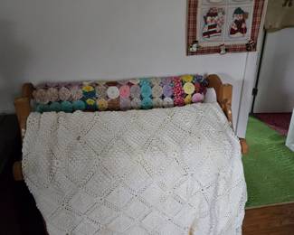 Large crocheted bedspread and yo-yo quilt