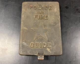 Cast brass police and fire guide