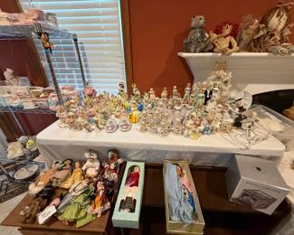 Figurines on this table will be $2 each and the dolls on the wood shelf $1 each. 
