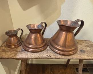 Set of Three Graduated Copper Measuring Jugs