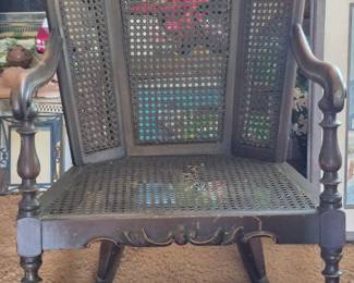 Antique cane back bottom rocking chair