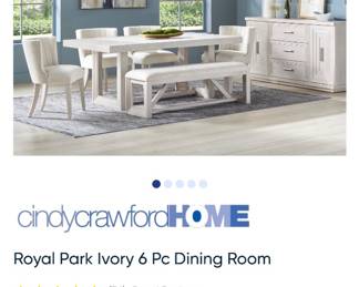 Complete Cindy Crawford Home Royal Park ivory dining room set including dining table, chairs, bench, and matching cabinet/server. Like-new condition with beautifully maintained contemporary furnishings throughout the home.