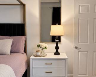 Two oversized RH-inspired gold framed mirrors available along with two tall contemporary table lamps featuring built-in charging functionality. Oversized area rug measuring over 10 ft also available. Contemporary bedroom furnishings and decor throughout the home in like-new condition.