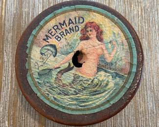 Reverse of wooden spool with Mermaid Brand Label