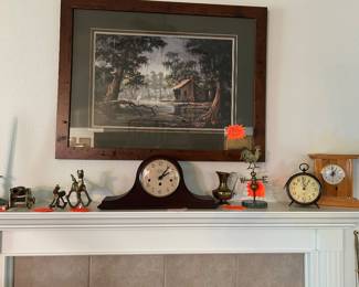 Numerous clocks and vintage brass collectibles