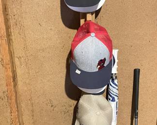 Titleist and other caps. Golf umbrella.