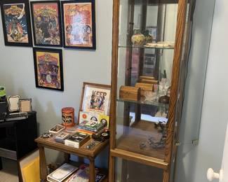 Display case, end table, framed Ringling Bros programs, boomerangs. 