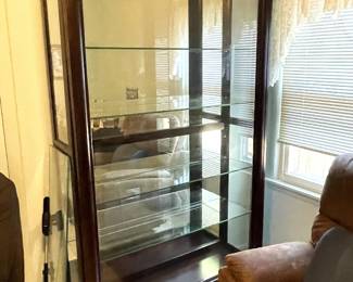 Large, beautiful, sliding door display cabinet. 
