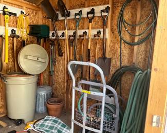 garden shed items - wheelbarrow, garden tools, decor, etc