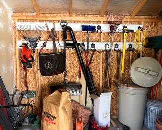 garden shed items - wheelbarrow, garden tools, decor, etc