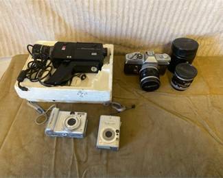 Three Canon Cameras And A Anscomatic Vintage Video Camera