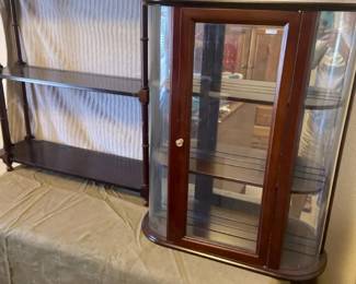 A Knickknack Shelf And A Glass Shadow Box