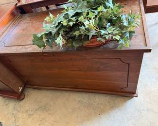 For sale is a vintage wooden cedar chest, often referred to as a "hope chest," featuring a classic traditional design.