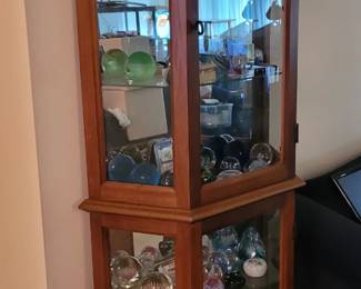 Curio cabinet with paper weights