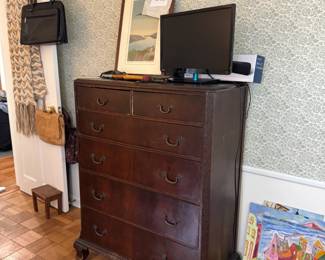 Anne Silber signed artwork up top. Antique dresser and Toshiba 23" tv. Super colorful Peter Duncan paintings on floor!