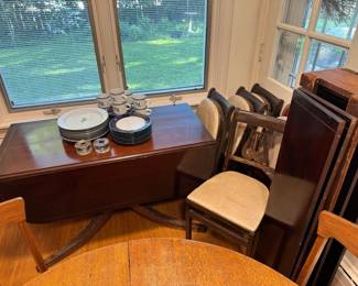Antique drop leaf and swivel dining table with rounded edges. 4 leaves with crate. Dansk Trivoli and Concerto dishes