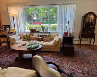 The sweetest single arch French curio cabinet with Queen Anne legs, Vintage W&J Sloane down-filled couch and matching chair. Cute, colorful collection of vintage needlepoint pillows