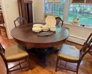 This table is so beautiful and will truly last forever! Round table comes with 6 chairs total and 5 leaves in standing crate on left. Table is 54". Chairs are very easy to recover if desired. Beautiful Wedgwood Osier dishes