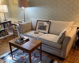 Signed lithograph of Thomas Hart Benton on loveseat. Loveseat is a sleeper sofa! Very clean, seldom used