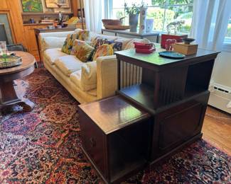 Neat pull out table. Baccarat crystal figurine collection up top
