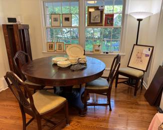 This table is so beautiful and will truly last forever! Round table comes with 6 chairs total and 5 leaves in standing crate on left. Table is 54". Chairs are very easy to recover if desired