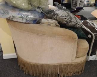 oversized fringed upholstered arm chair