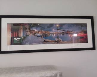 photographic print of waterway and cafe
