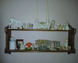 walnut wall shelves with many different small collectibles