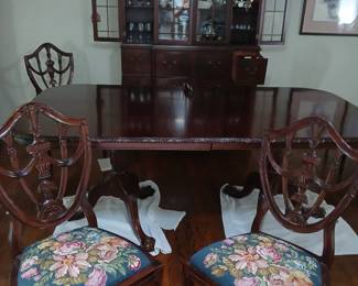 full dining room set up. gorgeous petit point new cushions on the chairs,